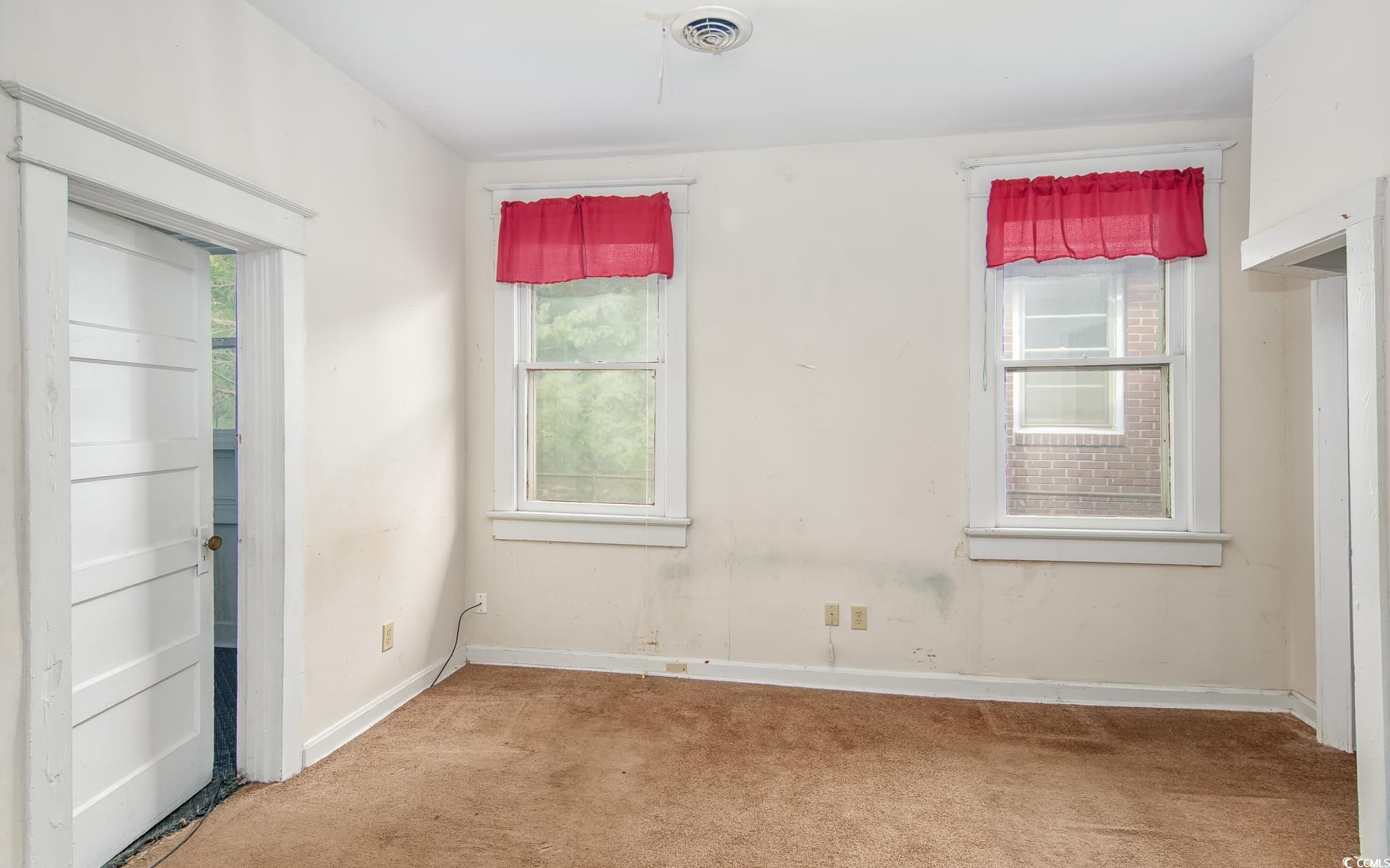 1019 Prince Street Georgetown, SC 29440 - Photo 13 of 22 Unfurnished room with carpet flooring, baseboards, and visible vents