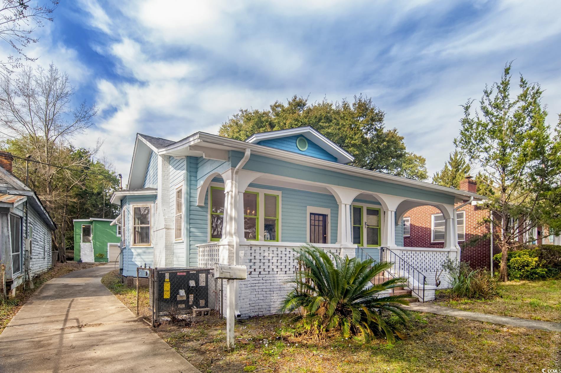 1019 Prince Street Georgetown, SC 29440 - Photo 2 of 22 View of front of home with brick siding, covered porch, and concrete driveway