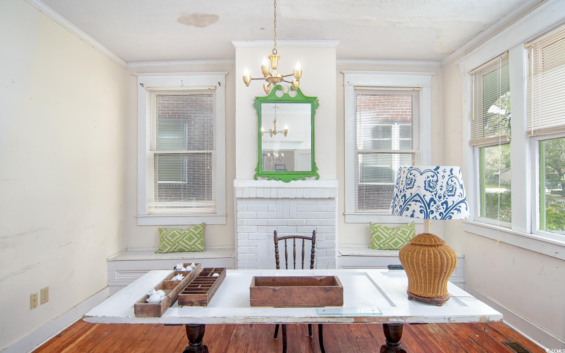 1019 Prince Street Georgetown, SC 29440 - Photo 8 of 22 Interior space featuring ornamental molding, baseboards, and a chandelier
