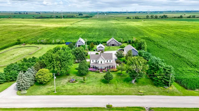 an aerial view of a house with outdoor space pool patio and outdoor seating
