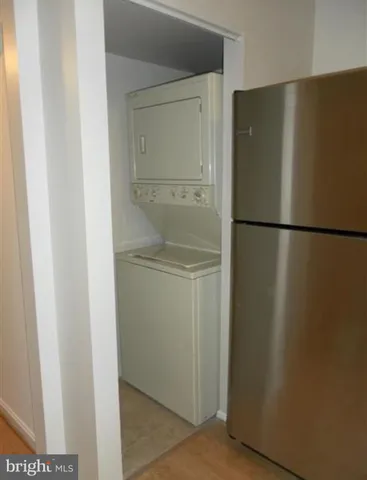 a white refrigerator freezer sitting in a kitchen