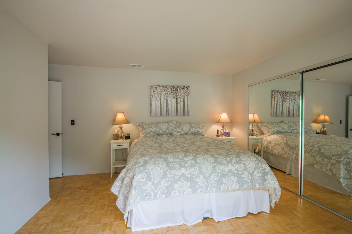 511 Fellowship Road Santa Barbara, CA 93109 - Photo 11 of 24 a bedroom with a bed and a lamp