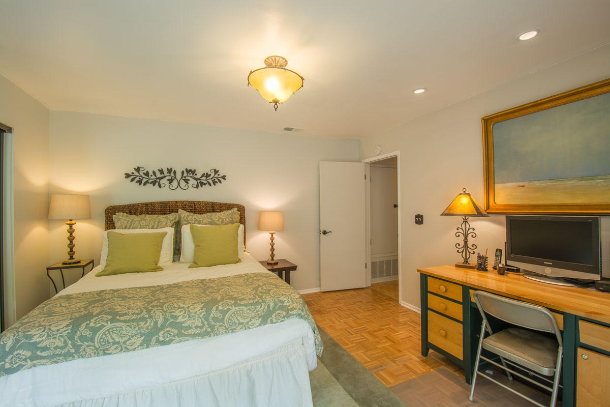 511 Fellowship Road Santa Barbara, CA 93109 - Photo 13 of 24 a bedroom with a bed and a flat screen tv