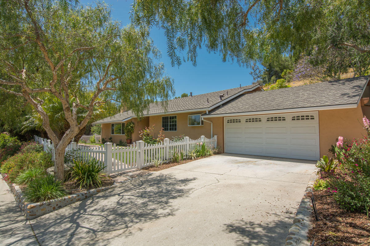 511 Fellowship Road Santa Barbara, CA 93109 - Photo 2 of 24 a view of a house with a small yard and large tree