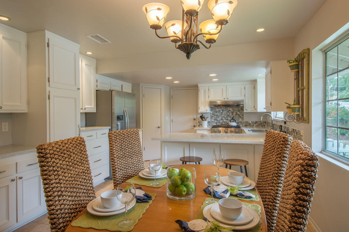 511 Fellowship Road Santa Barbara, CA 93109 - Photo 6 of 24 a kitchen with a sink and chandelier