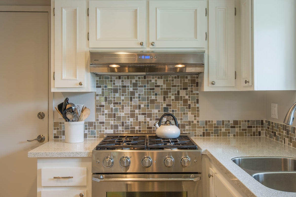 511 Fellowship Road Santa Barbara, CA 93109 - Photo 8 of 24 a stove top oven sitting inside of a kitchen