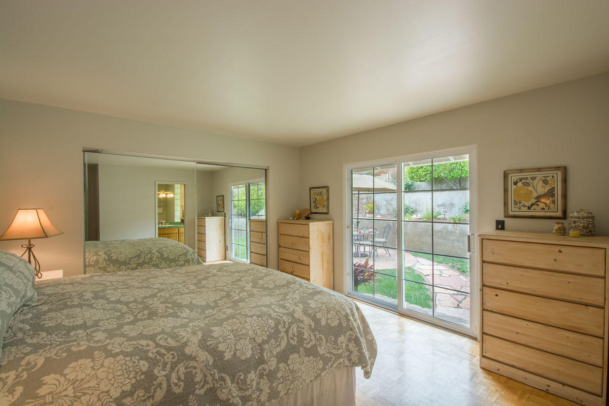 511 Fellowship Road Santa Barbara, CA 93109 - Photo 10 of 24 a bedroom with a bed and a large window