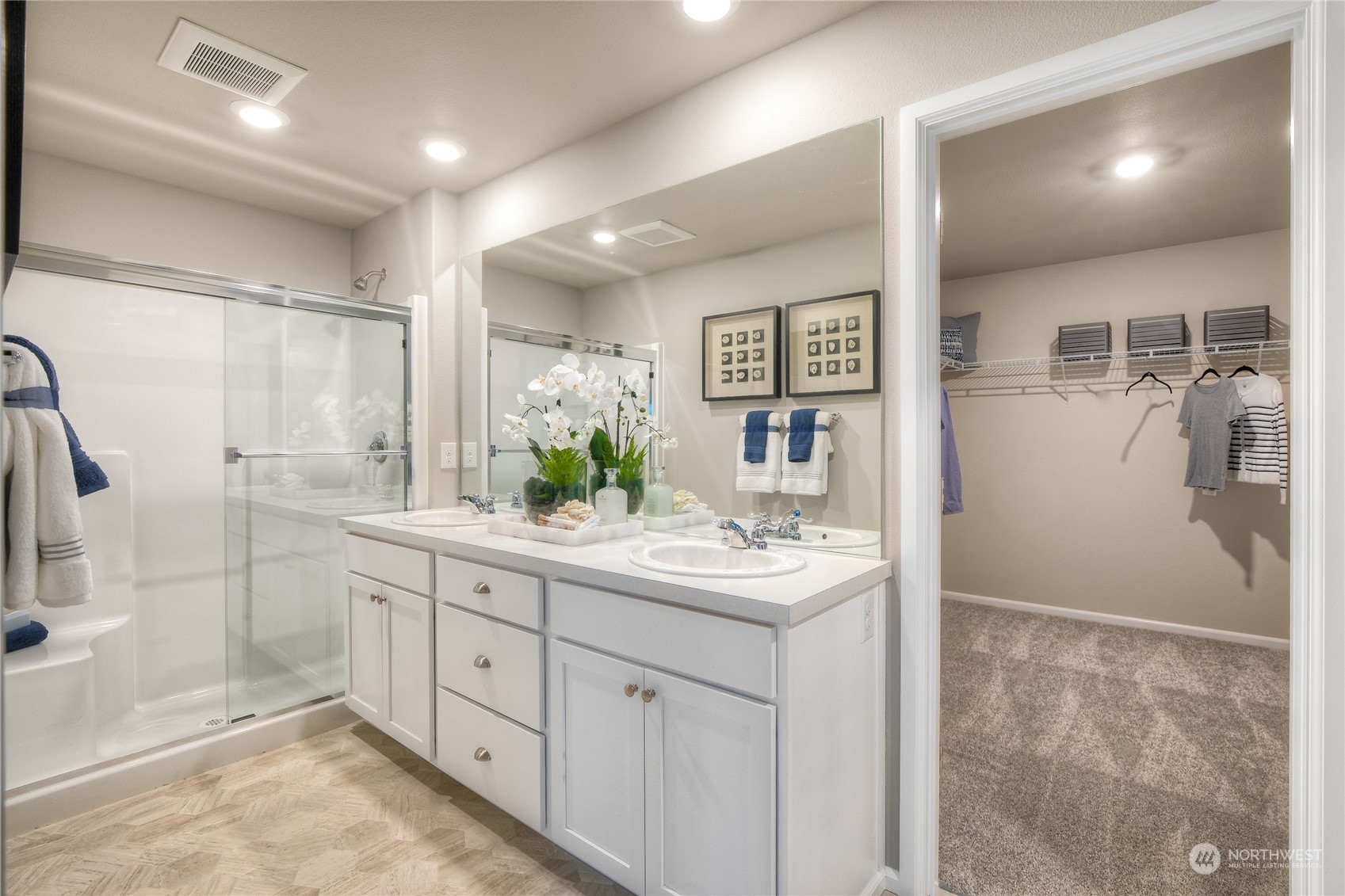 909 17th Avenue, Unit 159 Sultan, WA 98294 - Photo 12 of 15 a bathroom with a double vanity sink mirror and shower