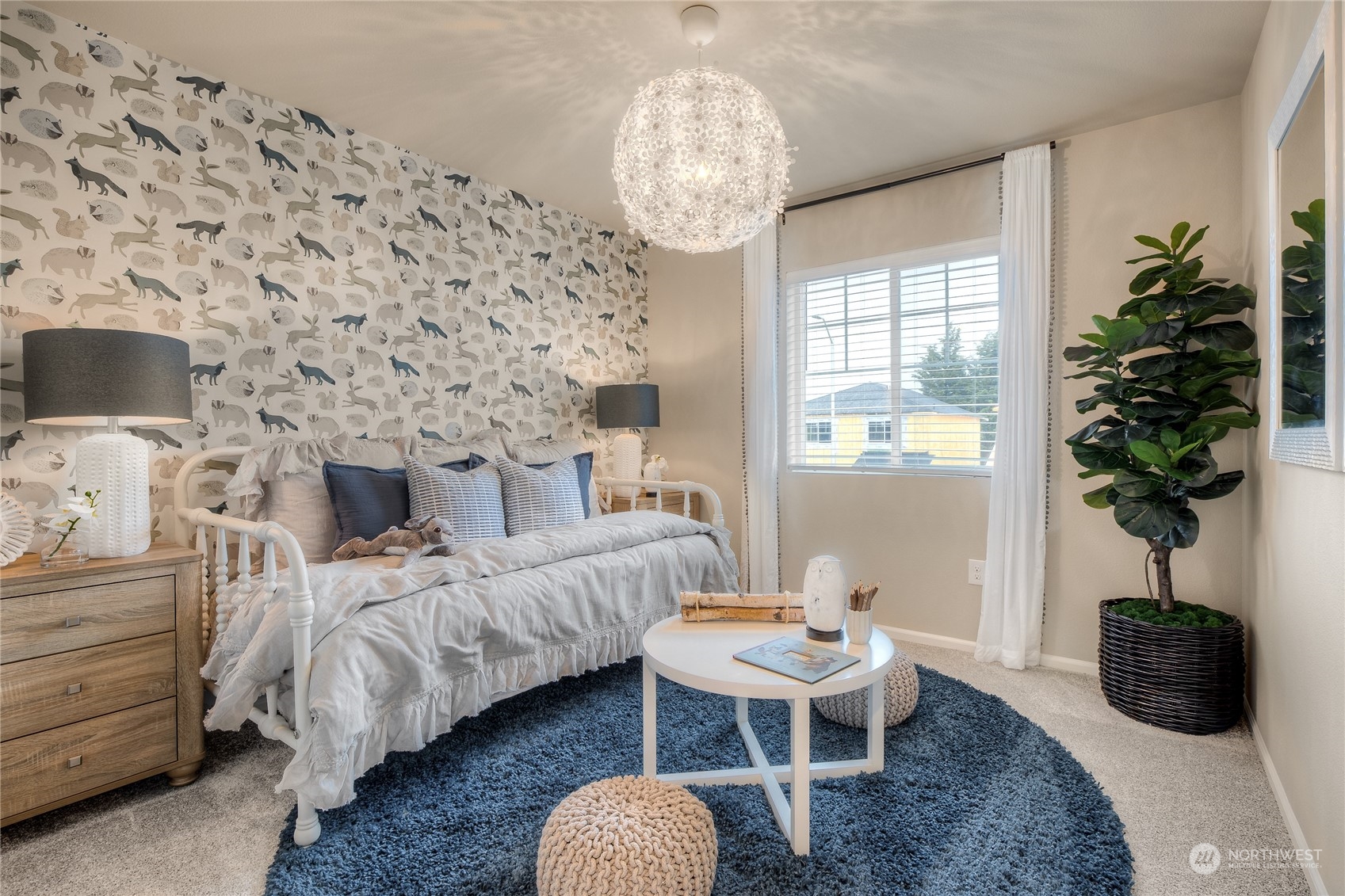 909 17th Avenue, Unit 159 Sultan, WA 98294 - Photo 7 of 15 a bedroom with a bed and a chandelier