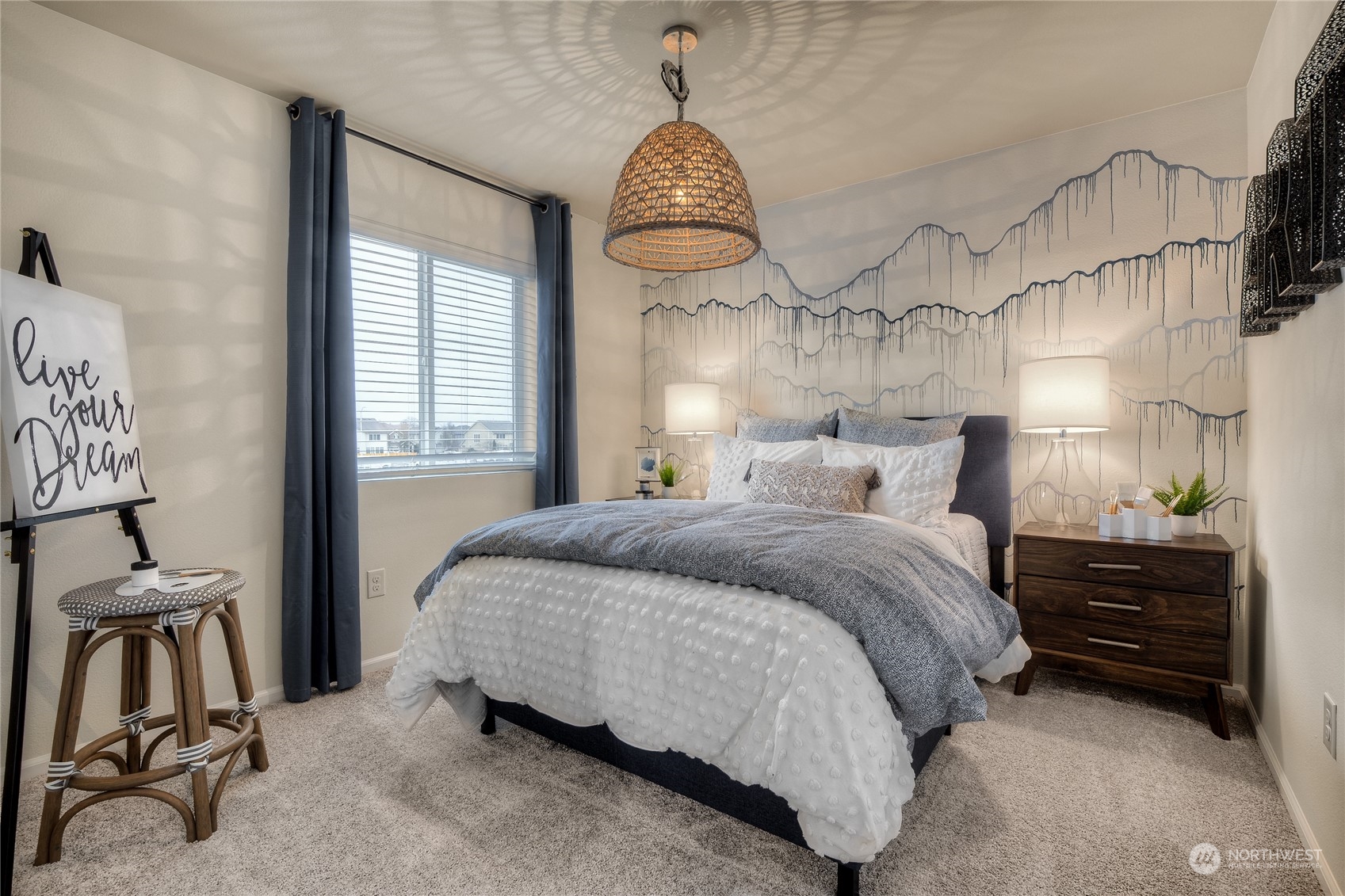 909 17th Avenue, Unit 159 Sultan, WA 98294 - Photo 10 of 15 a bedroom with a bed and a chandelier