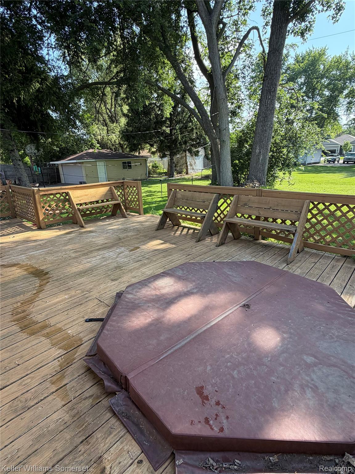 3277 Eastern Avenue Rochester, MI 48307 - Photo 13 of 13 Expansive wood deck with built-in lattice railing and bench seating