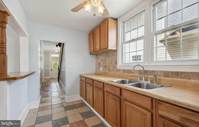 a kitchen with a sink and cabinets