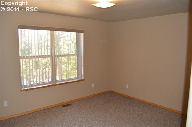 31 Spruce Creek Road Divide, CO 80814 - Photo 6 of 12 Master bedroom is your personal retreat with large walk in closet and roomy adjoining bath.