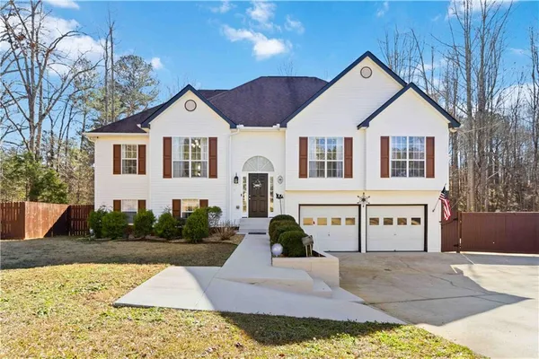 a front view of a house with garden