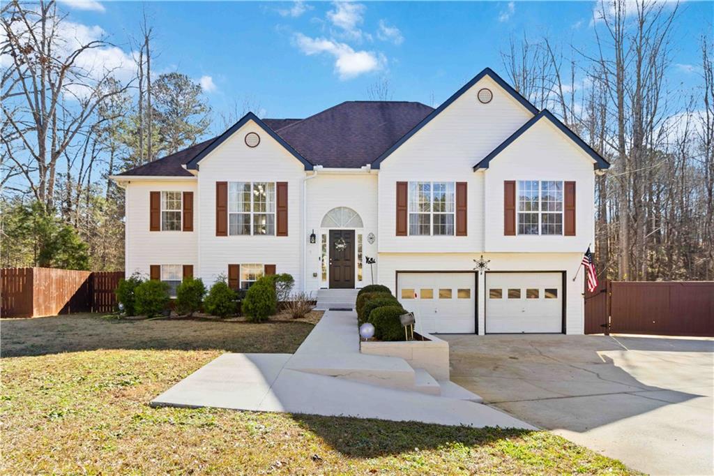 180 Harper Road McDonough, GA 30252 - Photo 1 of 63 a front view of a house with garden