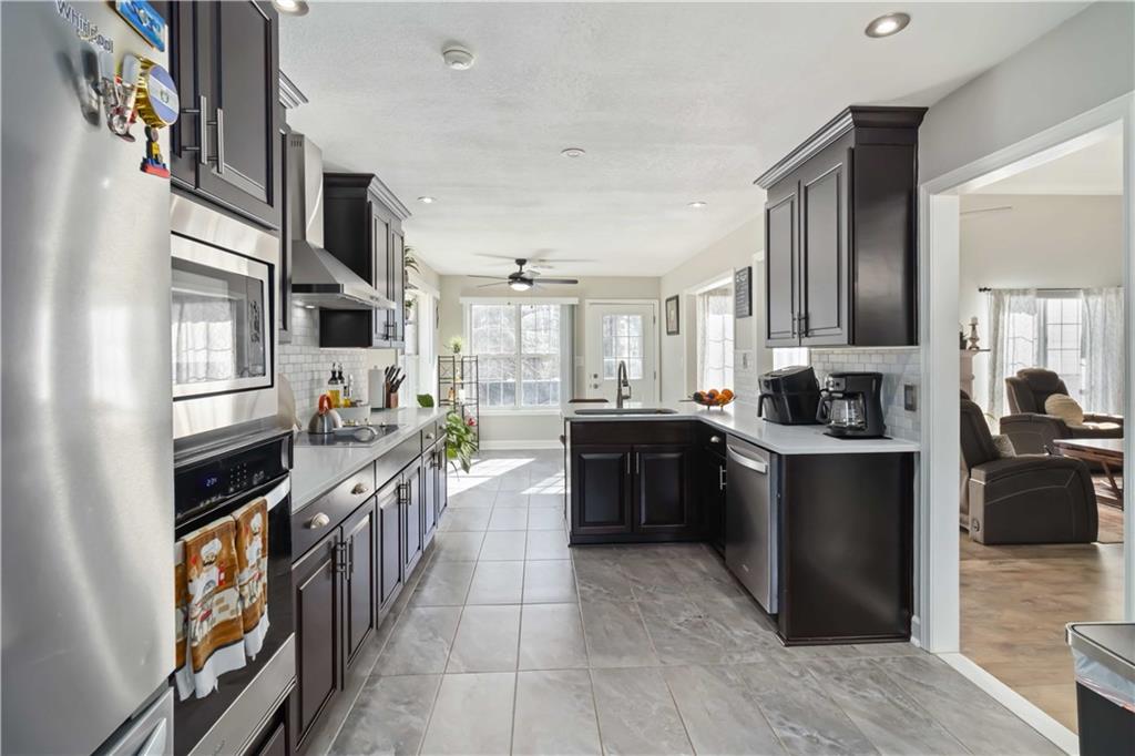 180 Harper Road McDonough, GA 30252 - Photo 15 of 63 a large kitchen with stainless steel appliances lots of counter top space