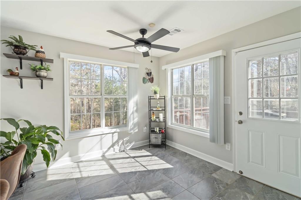 180 Harper Road McDonough, GA 30252 - Photo 18 of 63 a living room with furniture and a large window