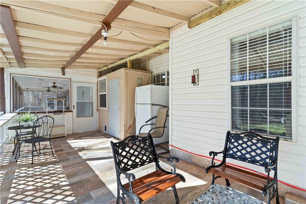 180 Harper Road McDonough, GA 30252 - Photo 20 of 63 a outdoor space with patio furniture and wooden floor