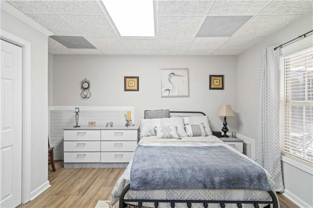 180 Harper Road McDonough, GA 30252 - Photo 22 of 63 a bedroom with a bed and window