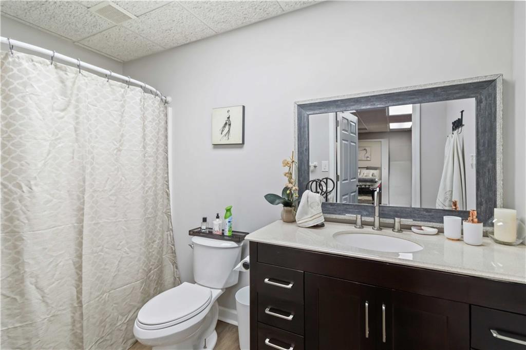 180 Harper Road McDonough, GA 30252 - Photo 24 of 63 a bathroom with a sink vanity mirror and toilet