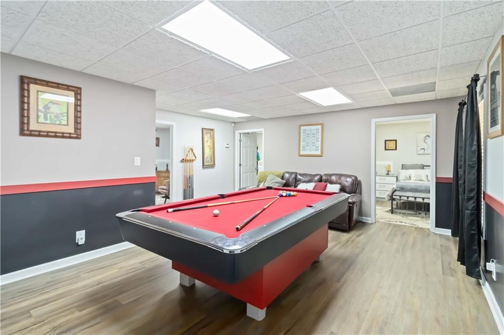 180 Harper Road McDonough, GA 30252 - Photo 26 of 63 a spacious bedroom with a bed and a table