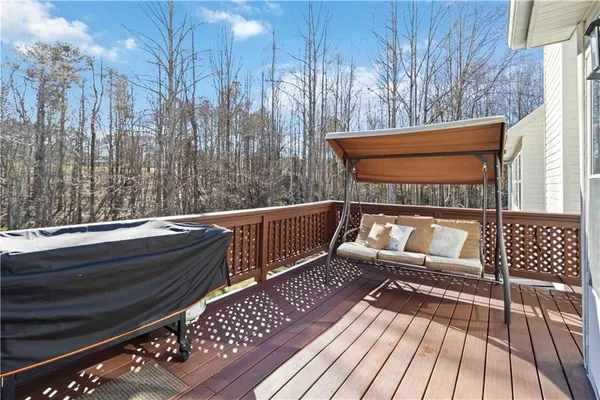 a bed room with a bed and a chair