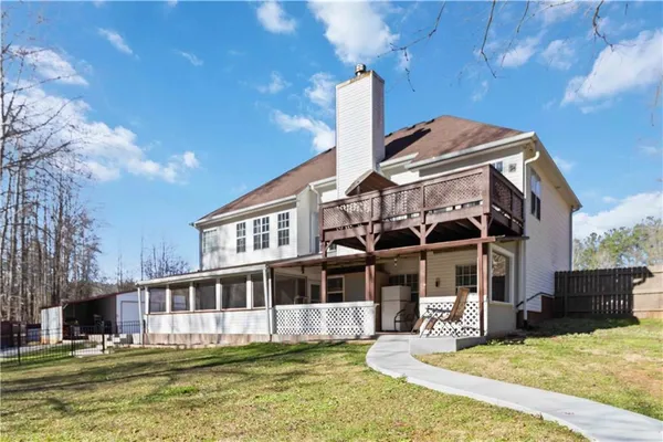 a bathroom with a tub sink and a shower