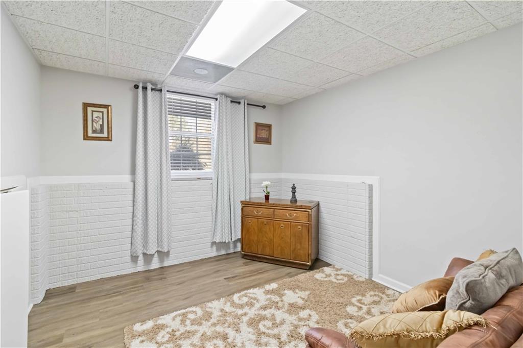 180 Harper Road McDonough, GA 30252 - Photo 4 of 63 a bedroom with a bed and wooden floor