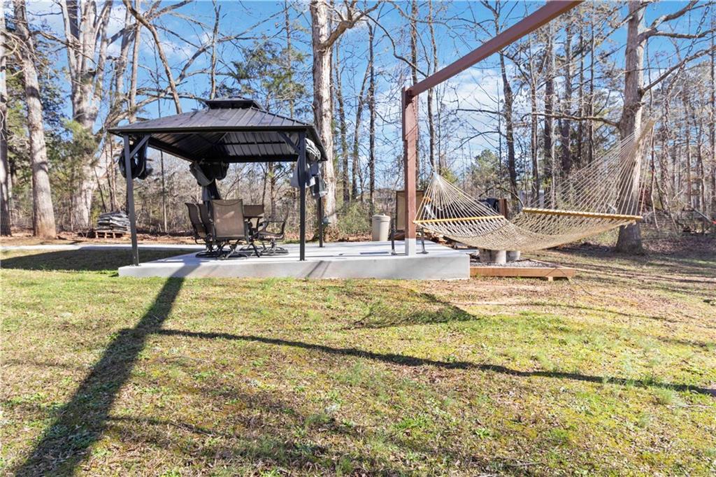 180 Harper Road McDonough, GA 30252 - Photo 42 of 63 a view of a swimming pool with an outdoor seating