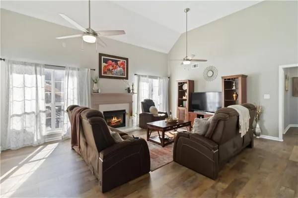 a view of a backyard with chairs