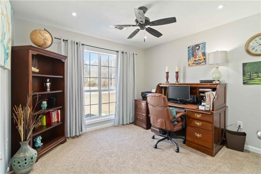 180 Harper Road McDonough, GA 30252 - Photo 45 of 63 a view of a workspace with furniture and a window
