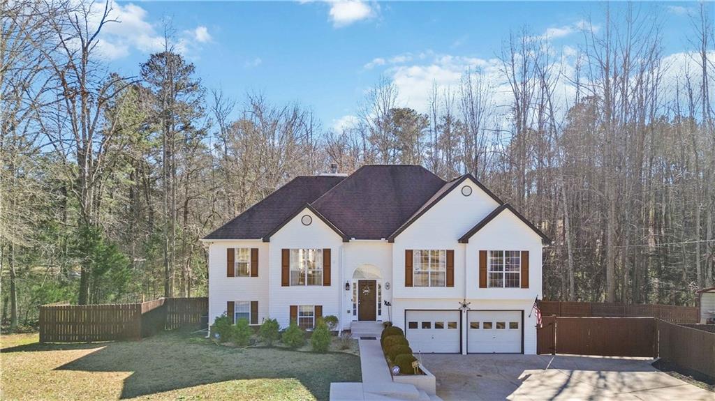 180 Harper Road McDonough, GA 30252 - Photo 47 of 63 a front view of a house with a yard