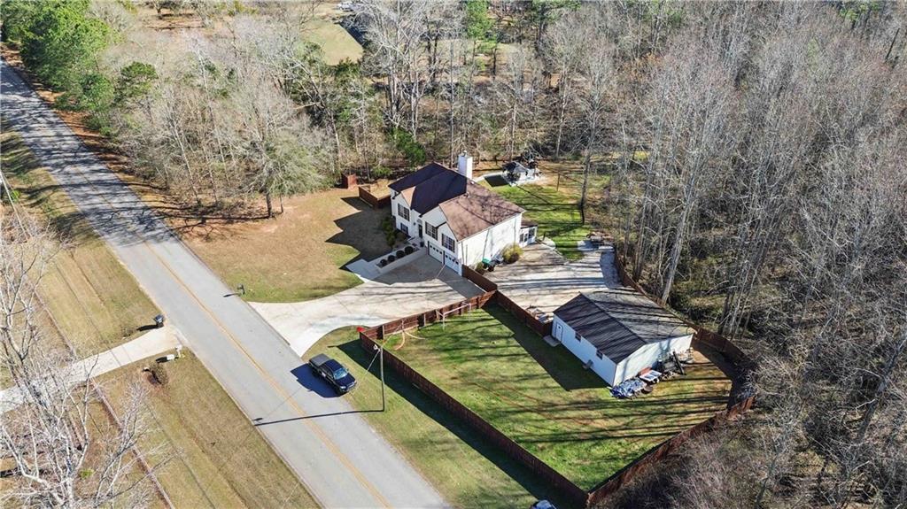 180 Harper Road McDonough, GA 30252 - Photo 50 of 63 a view of a backyard with chairs