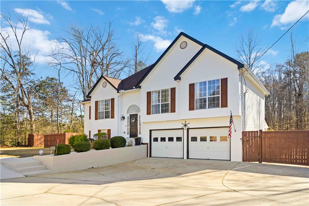 180 Harper Road McDonough, GA 30252 - Photo 5 of 63 a white house that has a tree on the side of it