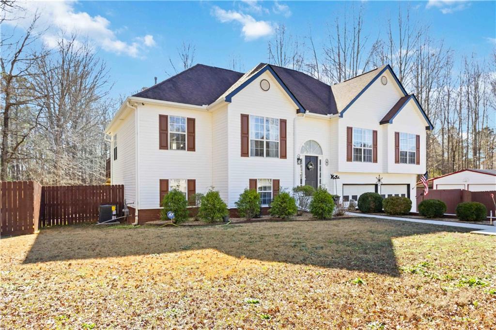 180 Harper Road McDonough, GA 30252 - Photo 9 of 63 a front view of a house with a yard