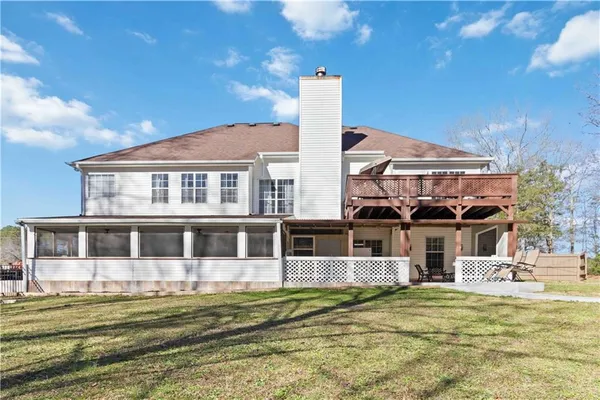 a kitchen with kitchen island granite countertop a table chairs stainless steel appliances and cabinets