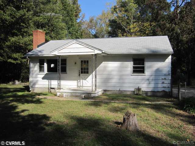 7712 Woodpecker Road Chesterfield, VA 23838 - Photo 1 of 10 a front view of a house with garden