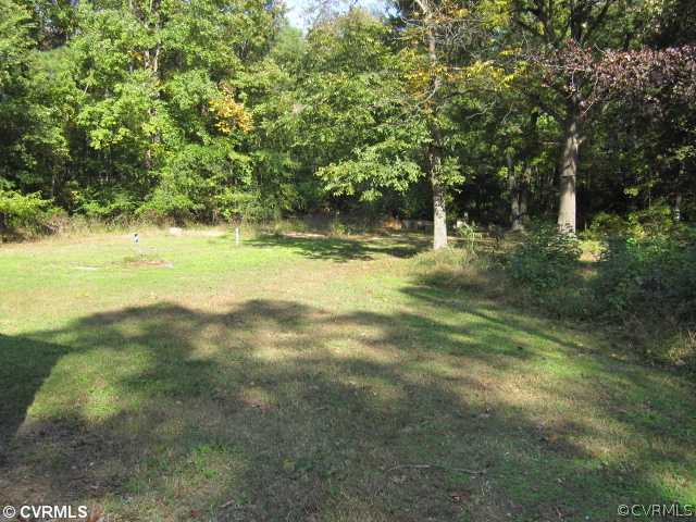 7712 Woodpecker Road Chesterfield, VA 23838 - Photo 10 of 10 a view of a yard with a tree