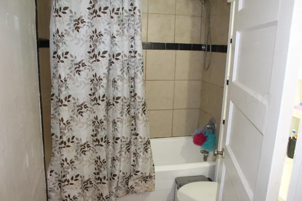 a bathroom with a bathtub and toilet