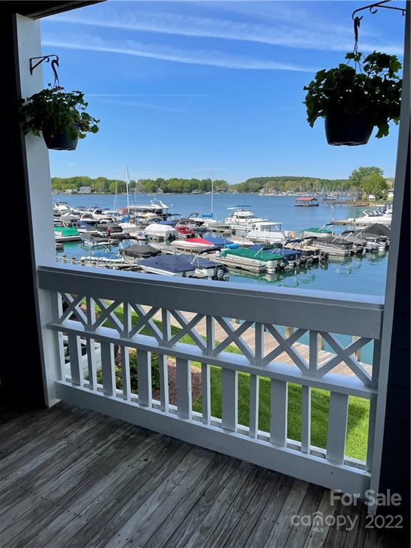 a view of a chairs and table in a balcony