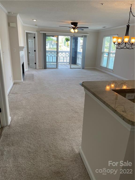 18679 Vineyard Point Lane Cornelius, NC 28031 - Photo 4 of 7 a view of an empty room with window and wooden floor