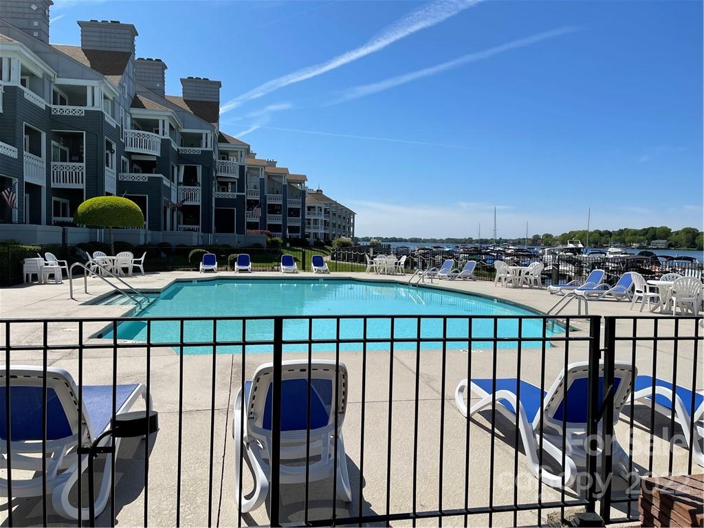 18679 Vineyard Point Lane Cornelius, NC 28031 - Photo 7 of 7 a balcony with table and chairs