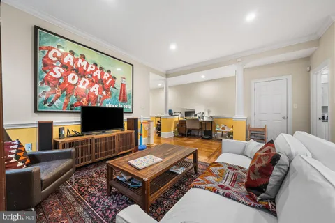 a living room with lots of furniture and a table