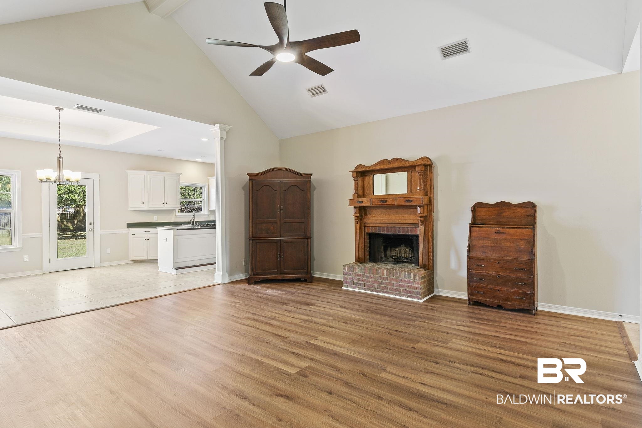 9631 Bay Meadows Avenue Fairhope, AL 36532 - Photo 9 of 49 Unfurnished living room featuring ceiling fan, high vaulted ceiling, and light hardwood / wood-style flooring