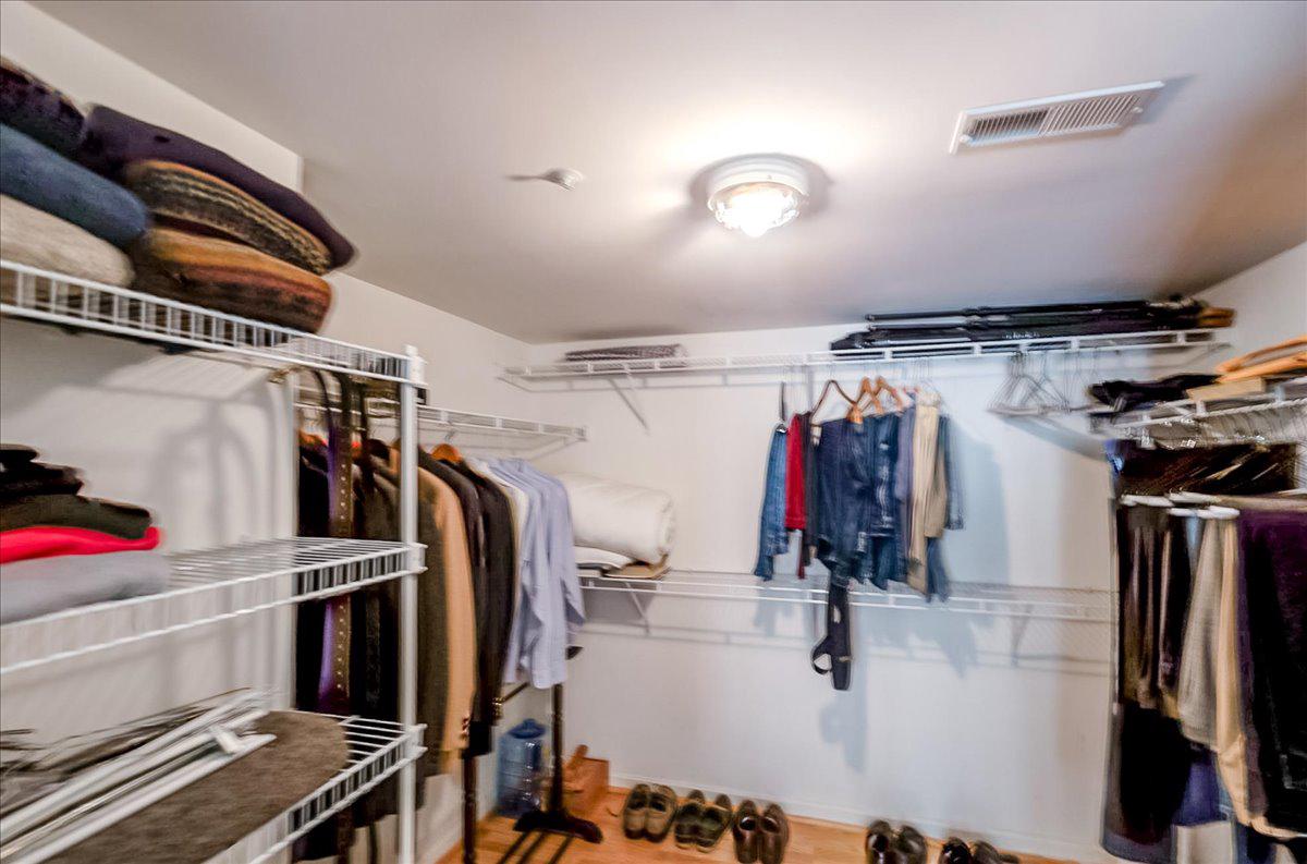 12320 Rosslare Ridge Road, Unit 201 Lutherville-Timonium, MD 21093 - Photo 30 of 41 Spacious walk in closet with organized storage.