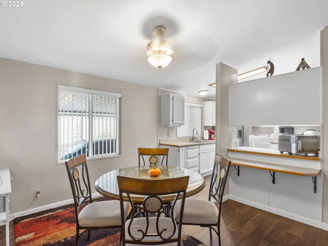 a view of a dining room with furniture and window