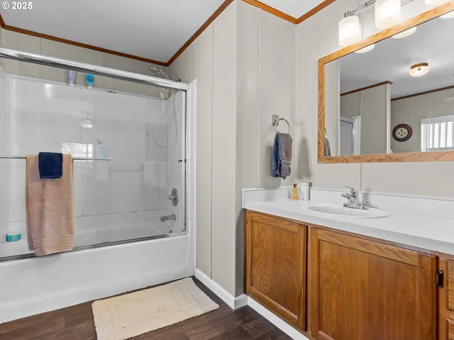 a bathroom with a bathtub a sink and a mirror