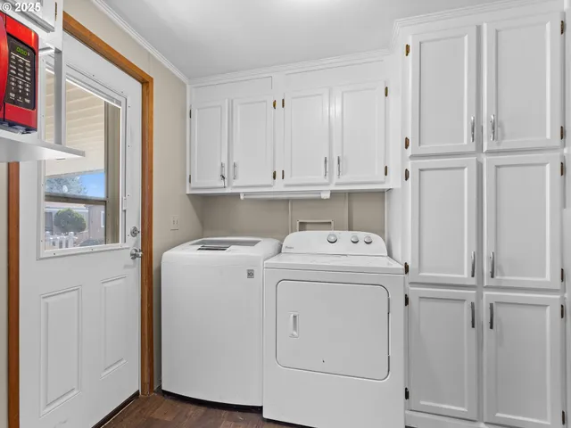 a view of storage and utility room with washer and dryer