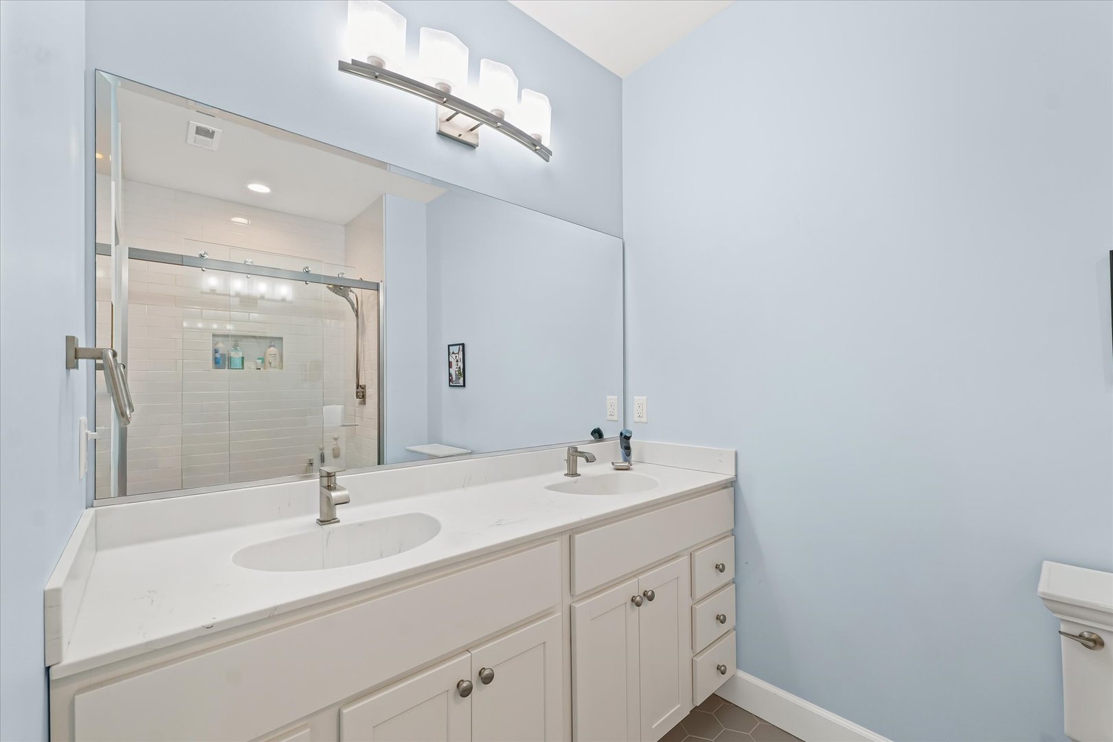 3407 Memory Lane Urbana, IL 61802 - Photo 20 of 30 a bathroom with a sink double vanity and a mirror