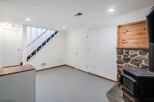 a view of an empty room with stairs